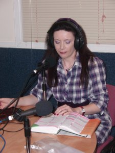 Laura in a studio during a radio show in Scotland.